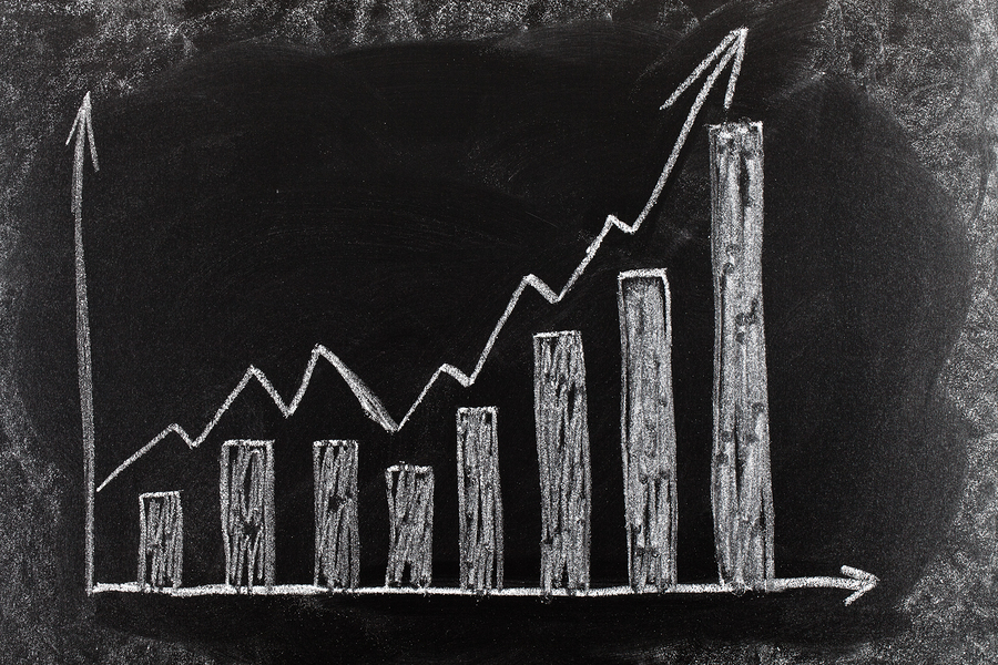 Business chart on blackboard showing increase in sales